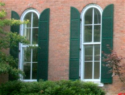 quarter-round arched exterior shutters on a Victorian Farmhouse