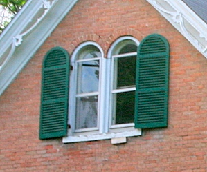 half-round arched exterior shutters on a Victorian Farmhouse