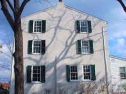 exterior shutters next to a chimney