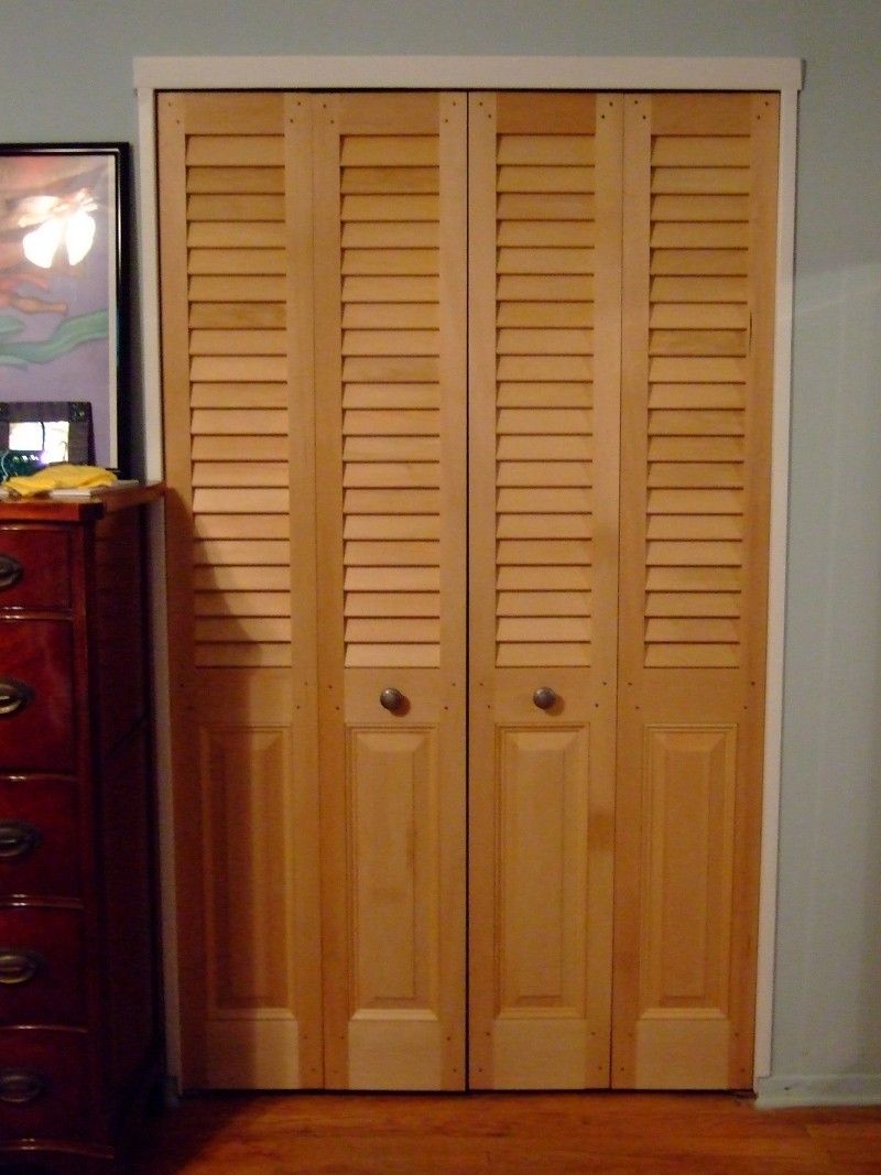 bifold closet doors with louvers over raised panel