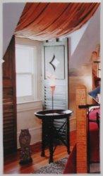 A combination of fixed louvers, raised panel with cut-out and a crenellated top make this shutter truly unique.  This shutter was designed specifically for the "Mansion in May 2001" designer show house in Morristown, New Jersey by Bifulco Design, Inc, Upper Montclair, New Jersey.