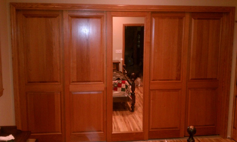 Combination of Colonial Raised Panel and Mirror Sliding Doors
