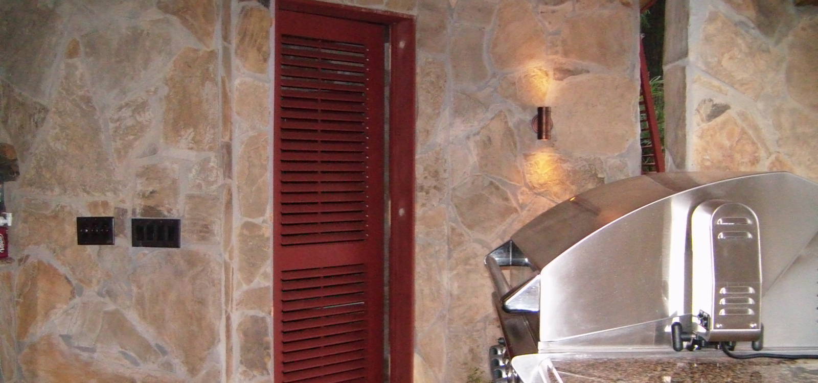 Outdoor Kitchen with Operable Louvered Door Outdoor Kitchen with Operable Louvered Door